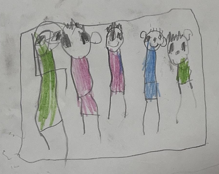Darwin (6) se dibuja reunido con su familia. Algunos están en Estados Unidos, otros todavía están en Venezuela.
